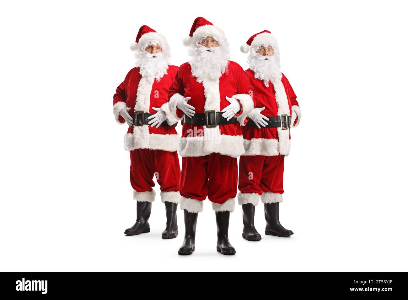 Three santa clauses standing and posing isolated on white background ...