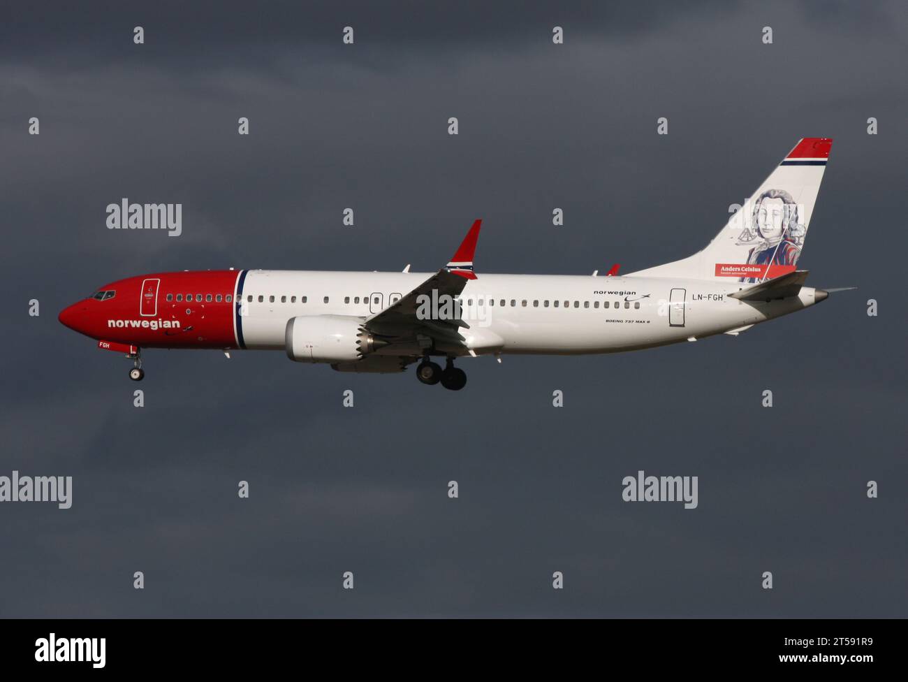 A Boeing 737-8 MAX of Norwegian with tail art dedicated to astronomer Anders Celsius approaches Gatwick Stock Photo