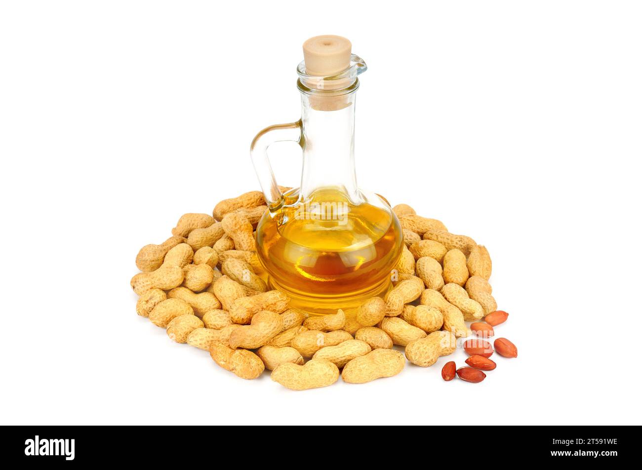 Peanuts and oil in bottle isolated on white background. Organic food
