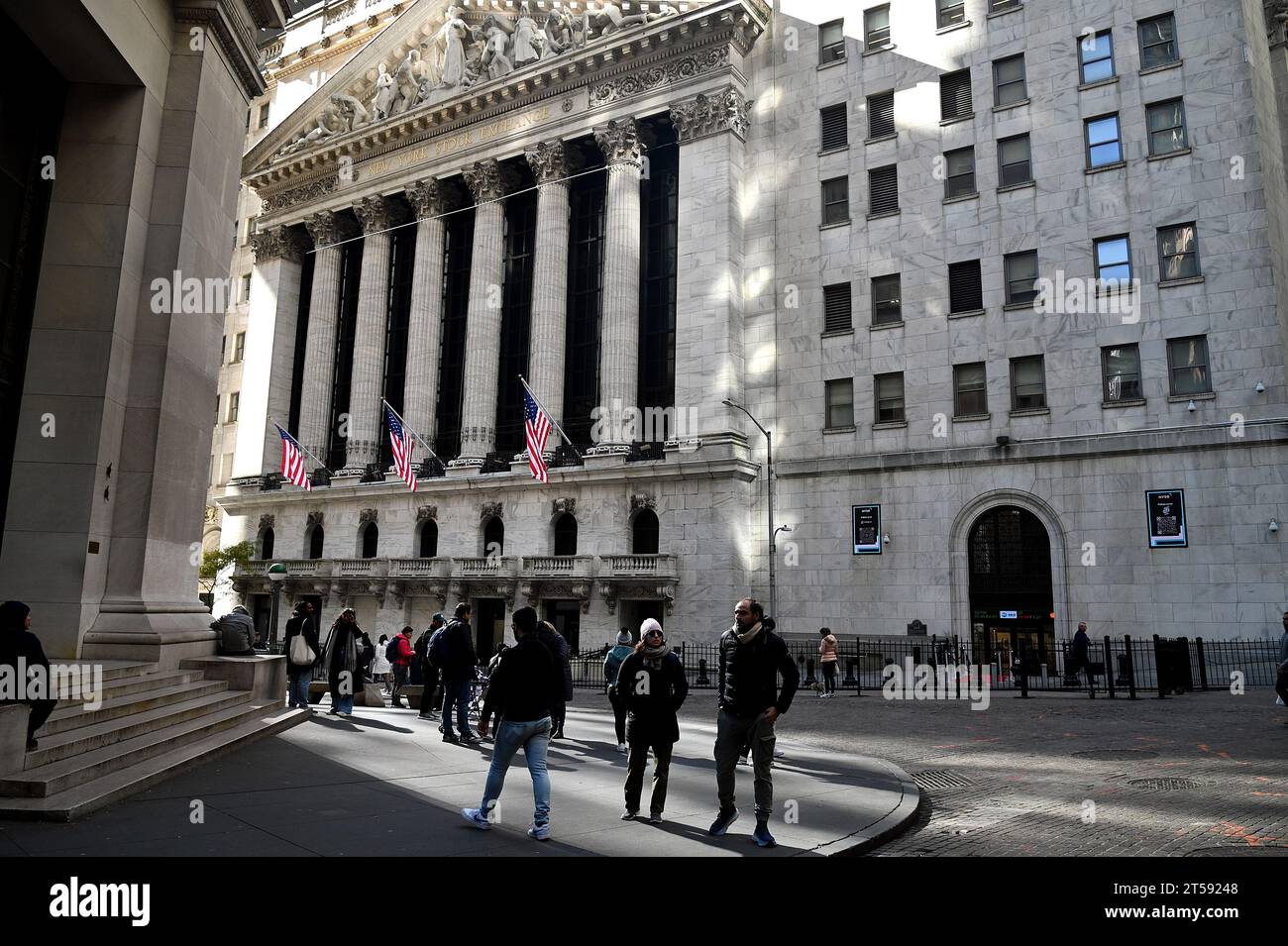 New York, USA. 03rd Nov, 2023. People walk outside of the New York Stock Exchange, New York, NY, November 3, 2023. Markets reacted to positive economic growth predictions as feds pause hike in interest rates and an unemployment rate of 3.9% with 150,000 jobs added to the economy. (Photo by Anthony Behar/Sipa USA) Credit: Sipa USA/Alamy Live News Stock Photo