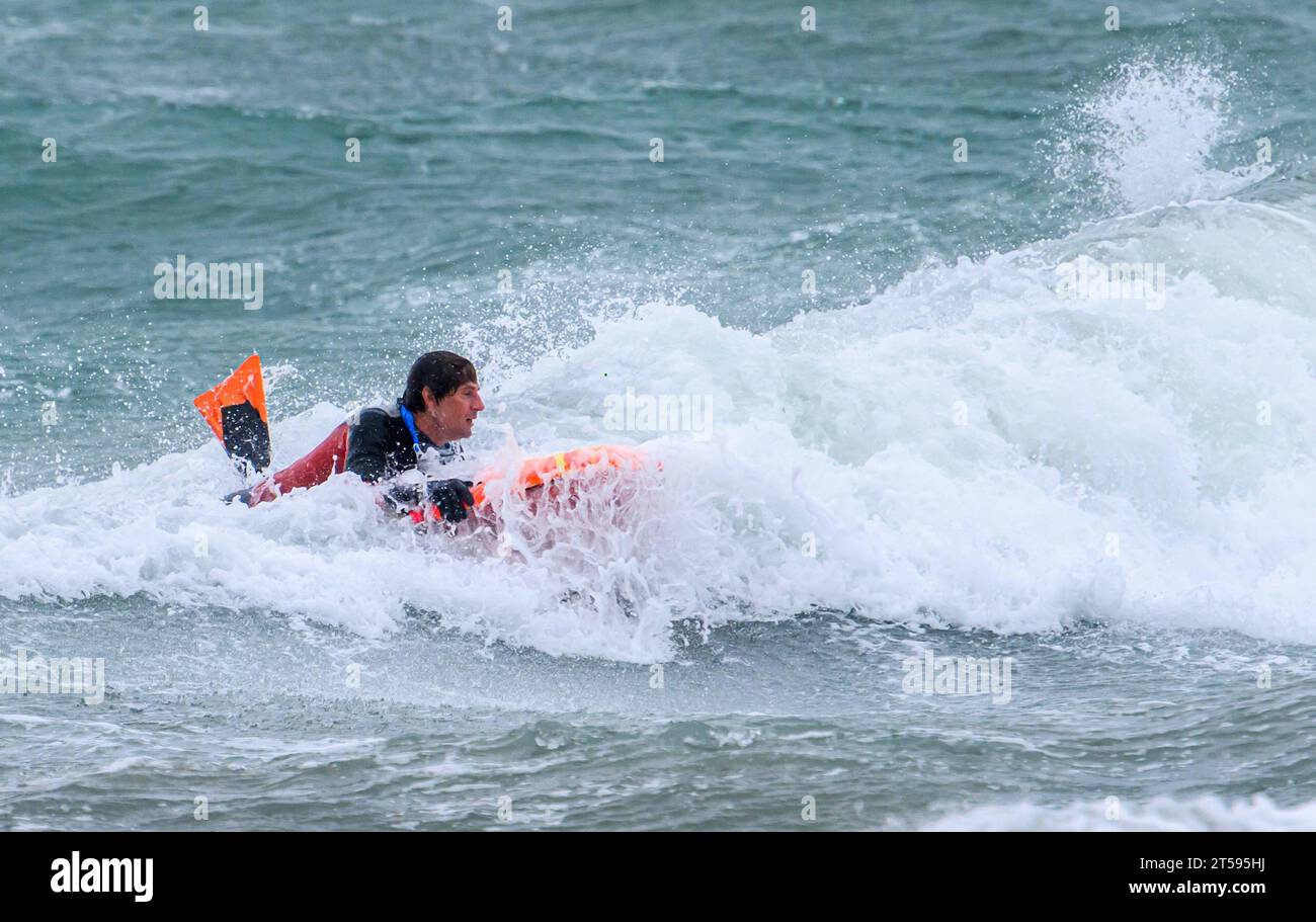 Croatia, Split, 031123. The stormy south changed to a southwesterly wind and created large waves that cause problems in maritime traffic and floods due to rising sea levels. In the photo: a brave surfer tries to overcome big waves along the coast of Bacvica. Photo: Tom Dubravec/CROPIX Split CROATIA Copyright: xxTomxDubravecx jugo lebicada bacvice14-031123 Credit: Imago/Alamy Live News Stock Photo