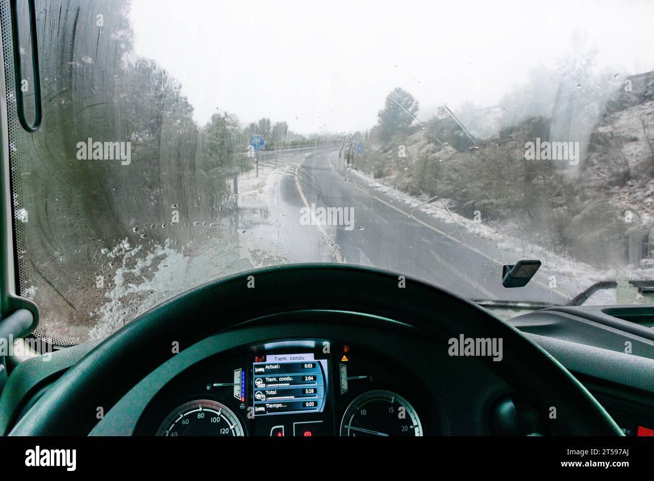 Interior of the cab of a truck with the windshield fogged by condensation due to the change in temperature. Stock Photo