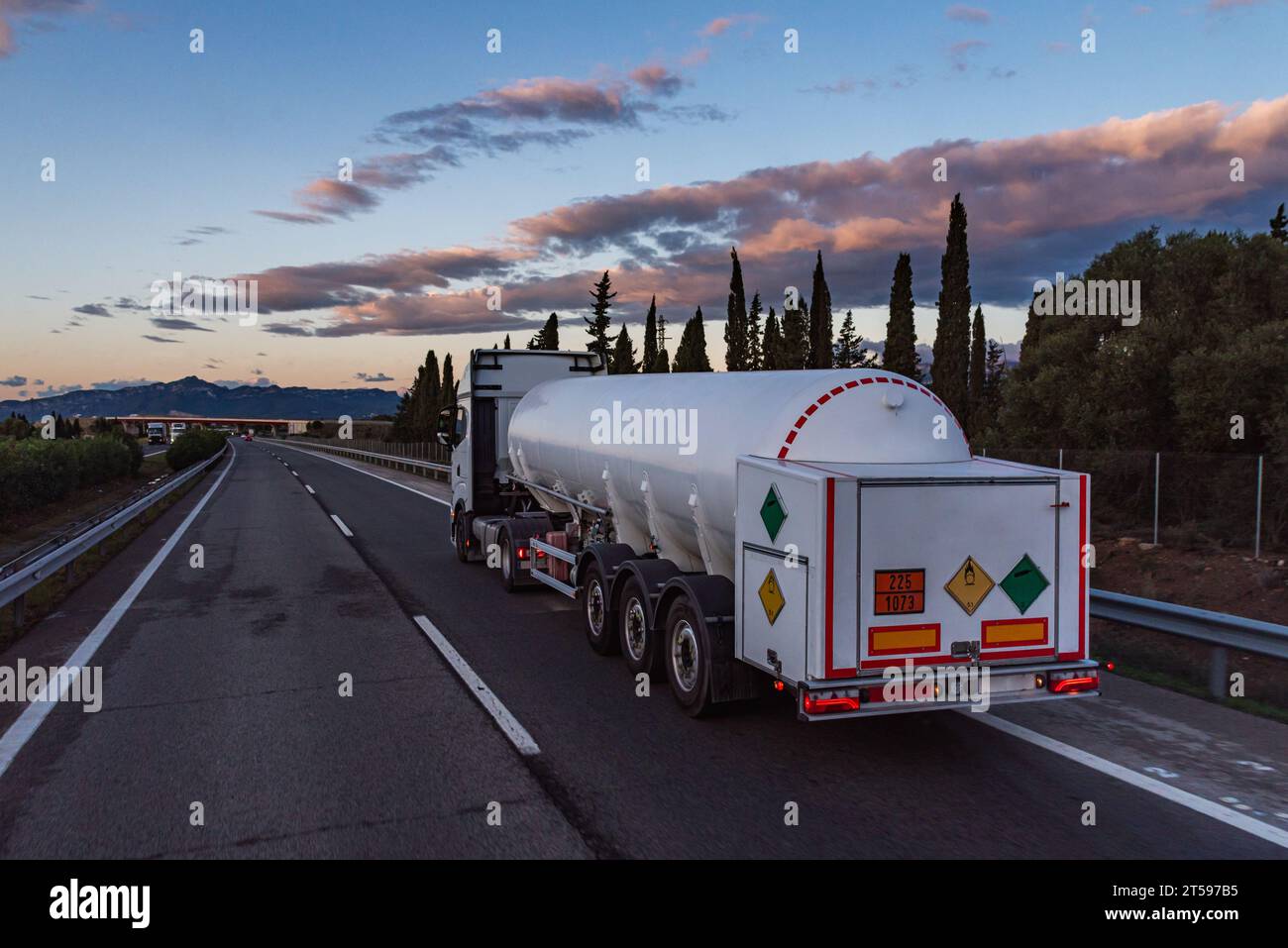 Tanker truck transporting refrigerated liquid oxygen, with ADR label for oxidizing product and not flammable. Stock Photo