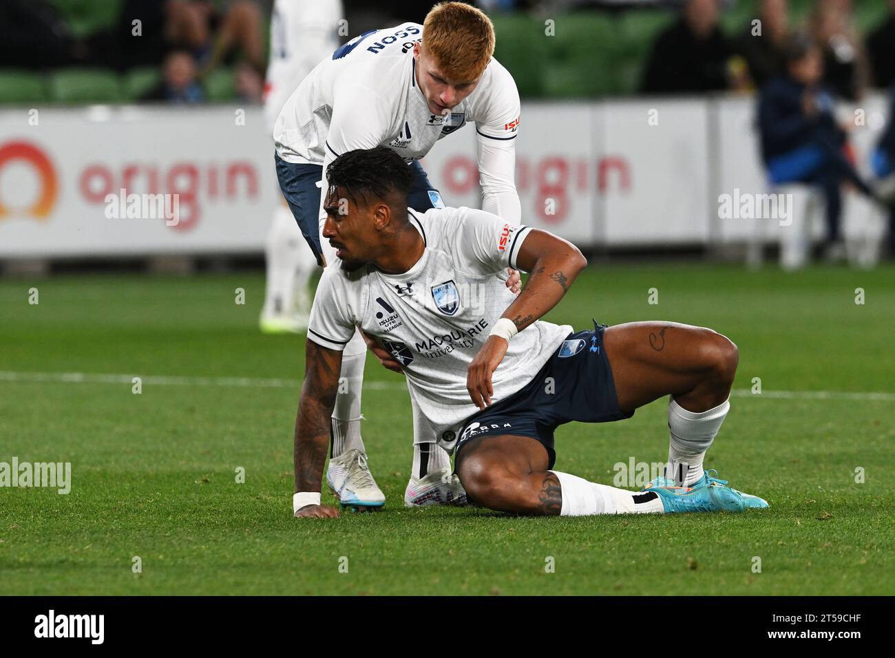 MELBOURNE, AUSTRALIA. 3 November, 2023. Isuzu UTE A-League Men football Melbourne City v Sydney FC. Sydney FC forward Mitchell Glasson(19) helps team mate Fabio Gomes Netto(9) up following a rough tackle during Sydney's away game against melbourne City at AAMI Park. Credit Karl Phillipson/Alamy Live News Stock Photo
