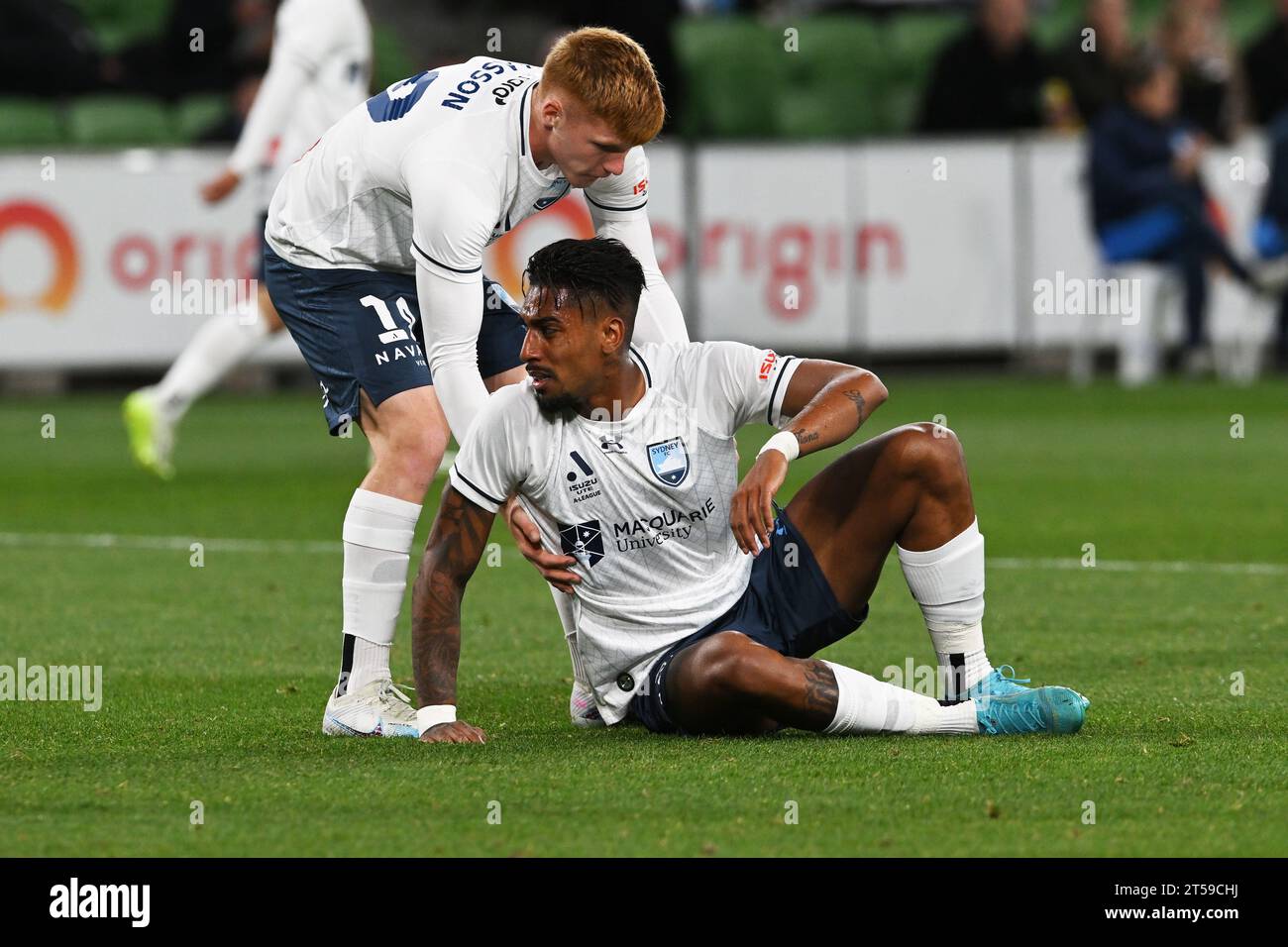 MELBOURNE, AUSTRALIA. 3 November, 2023. Isuzu UTE A-League Men football Melbourne City v Sydney FC. Sydney FC forward Mitchell Glasson(19) helps team mate Fabio Gomes Netto(9) up following a rough tackle during Sydney's away game against melbourne City at AAMI Park. Credit Karl Phillipson/Alamy Live News Stock Photo