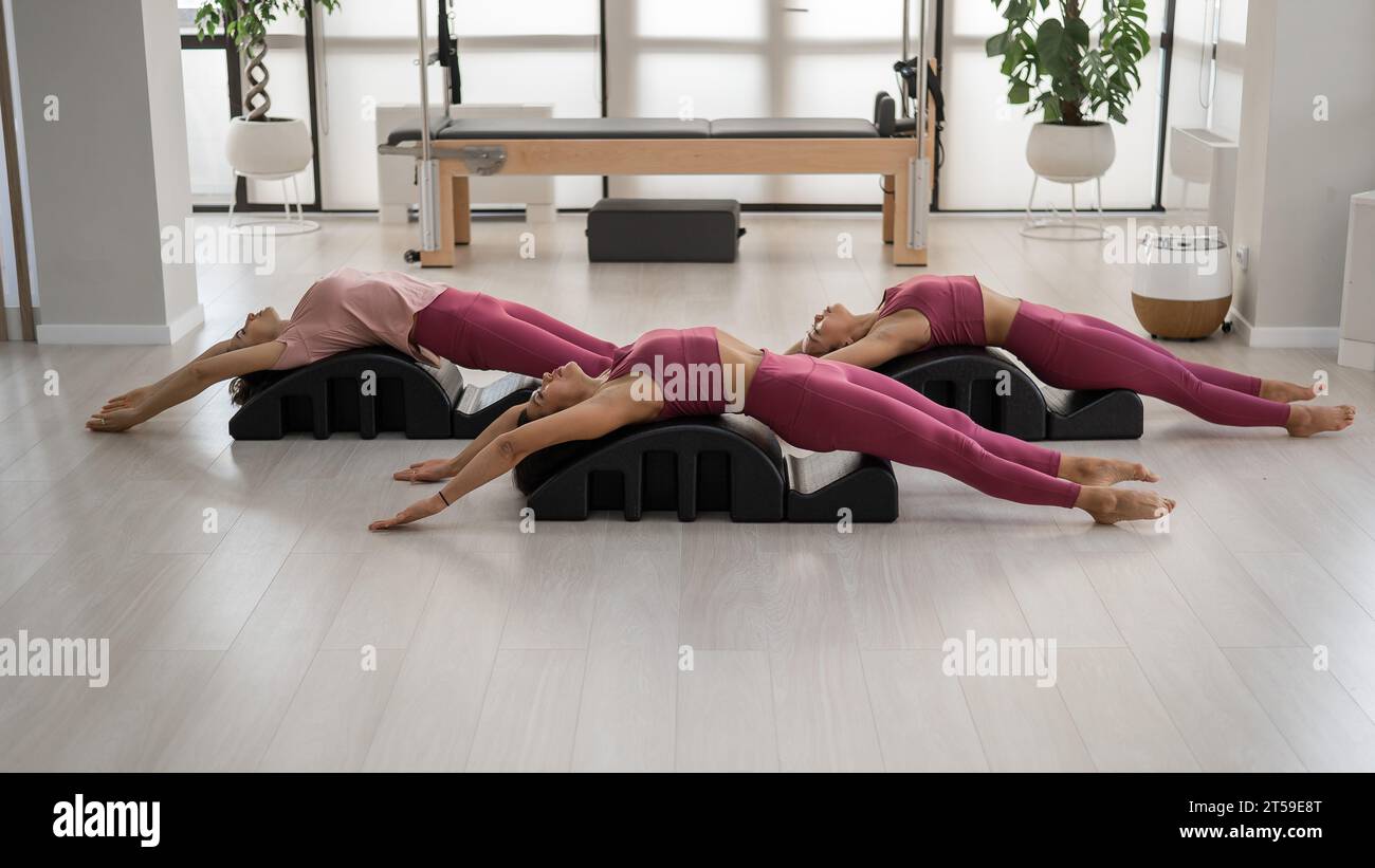 Balanced Body Pilates Arc. Three asian women exercising on pilates arc  Stock Photo - Alamy
