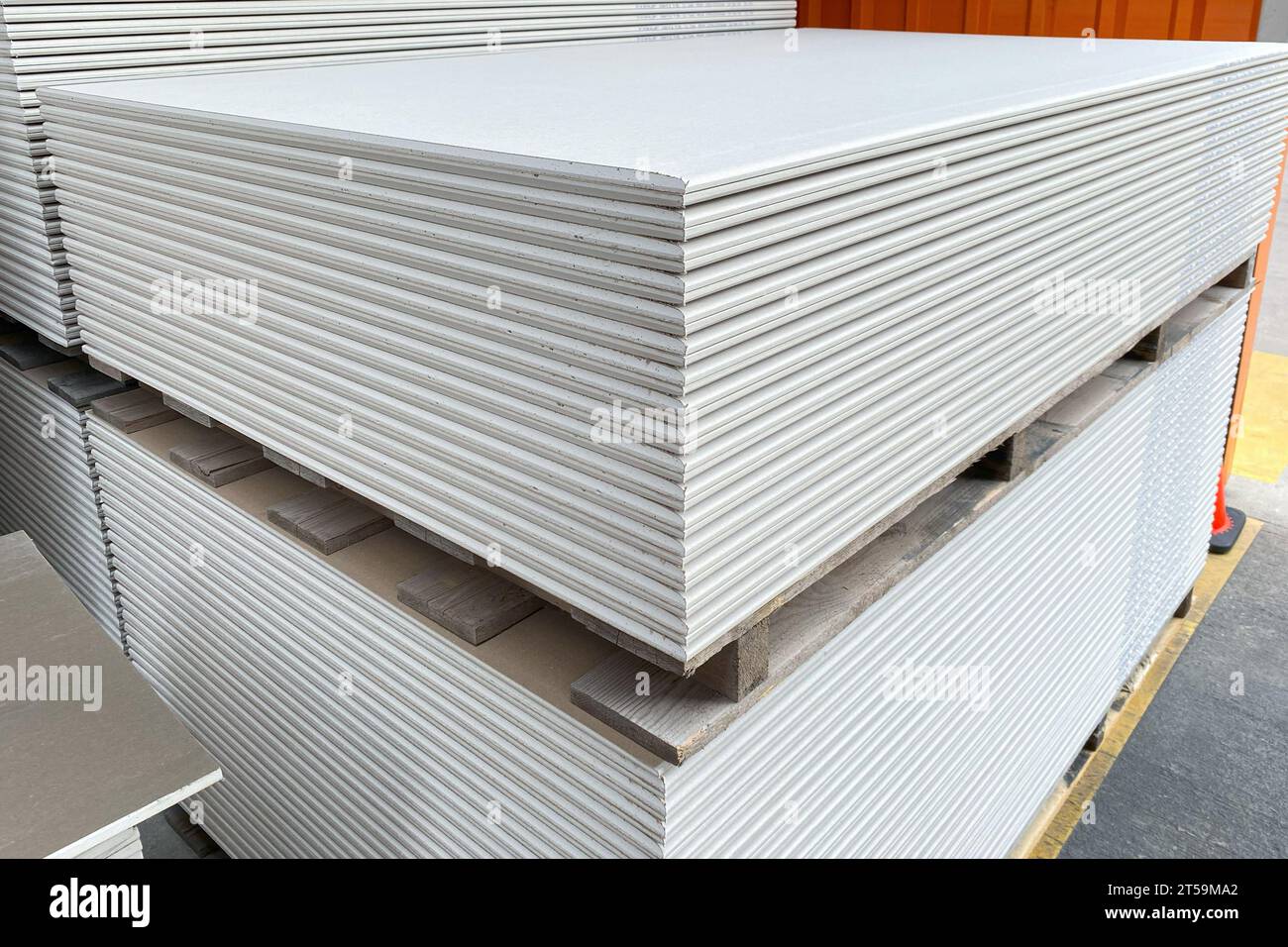 The stack of WHITE drywall Standard Gypsum board panel. Plasterboard