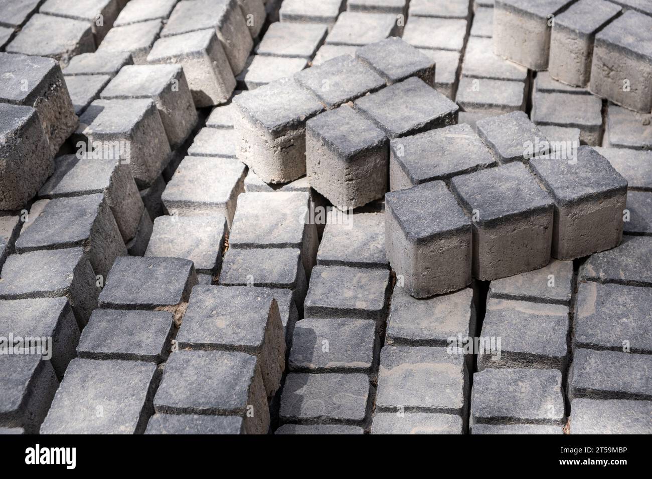 stack of gray cinder blocks, commonly used in road construction for