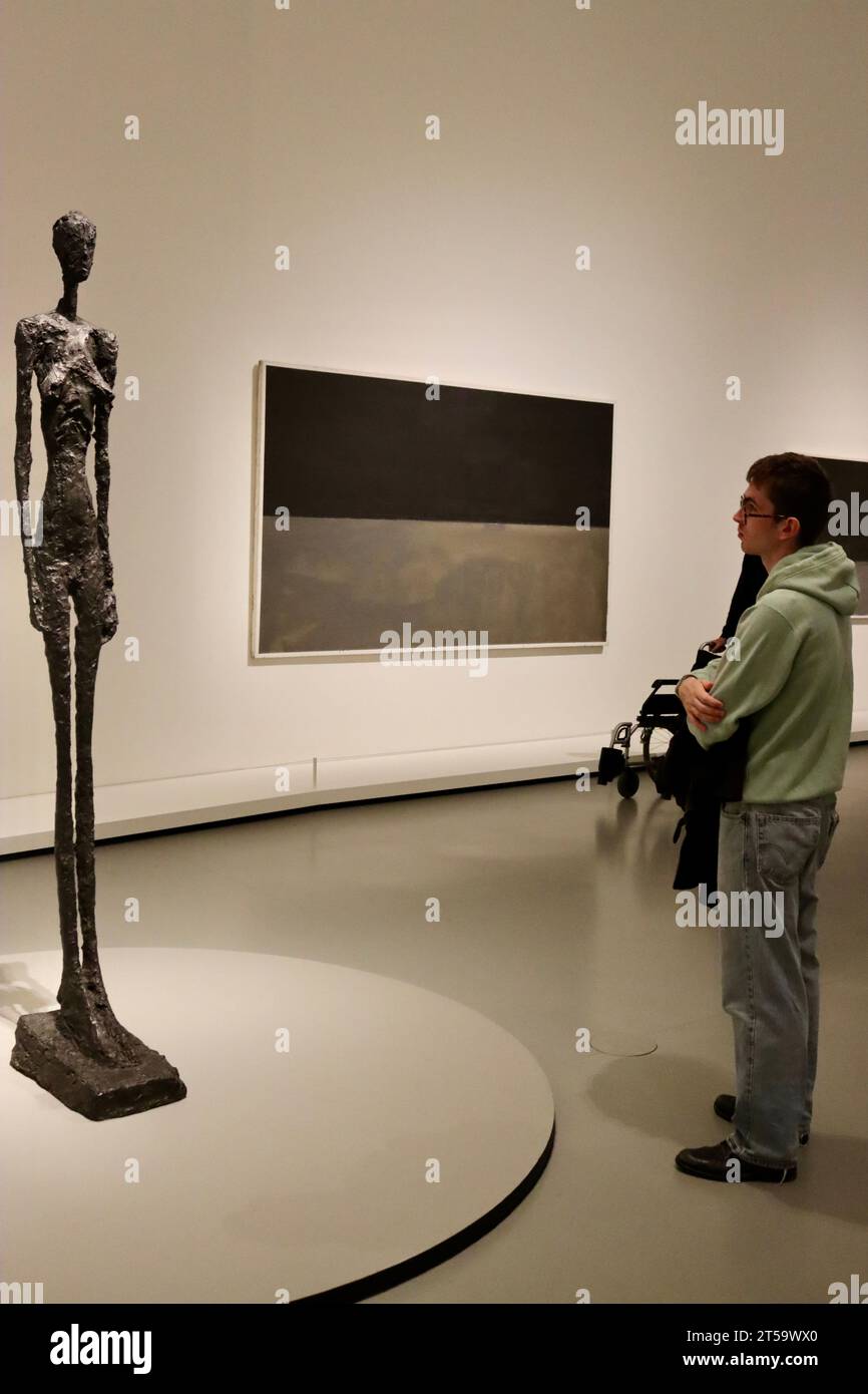 Viewing Mark Rothko paintings at the large Rothko exhibition at Fondation Louis Vuitton in Paris, France, October 2023.  Giacometti sculpture. Stock Photo