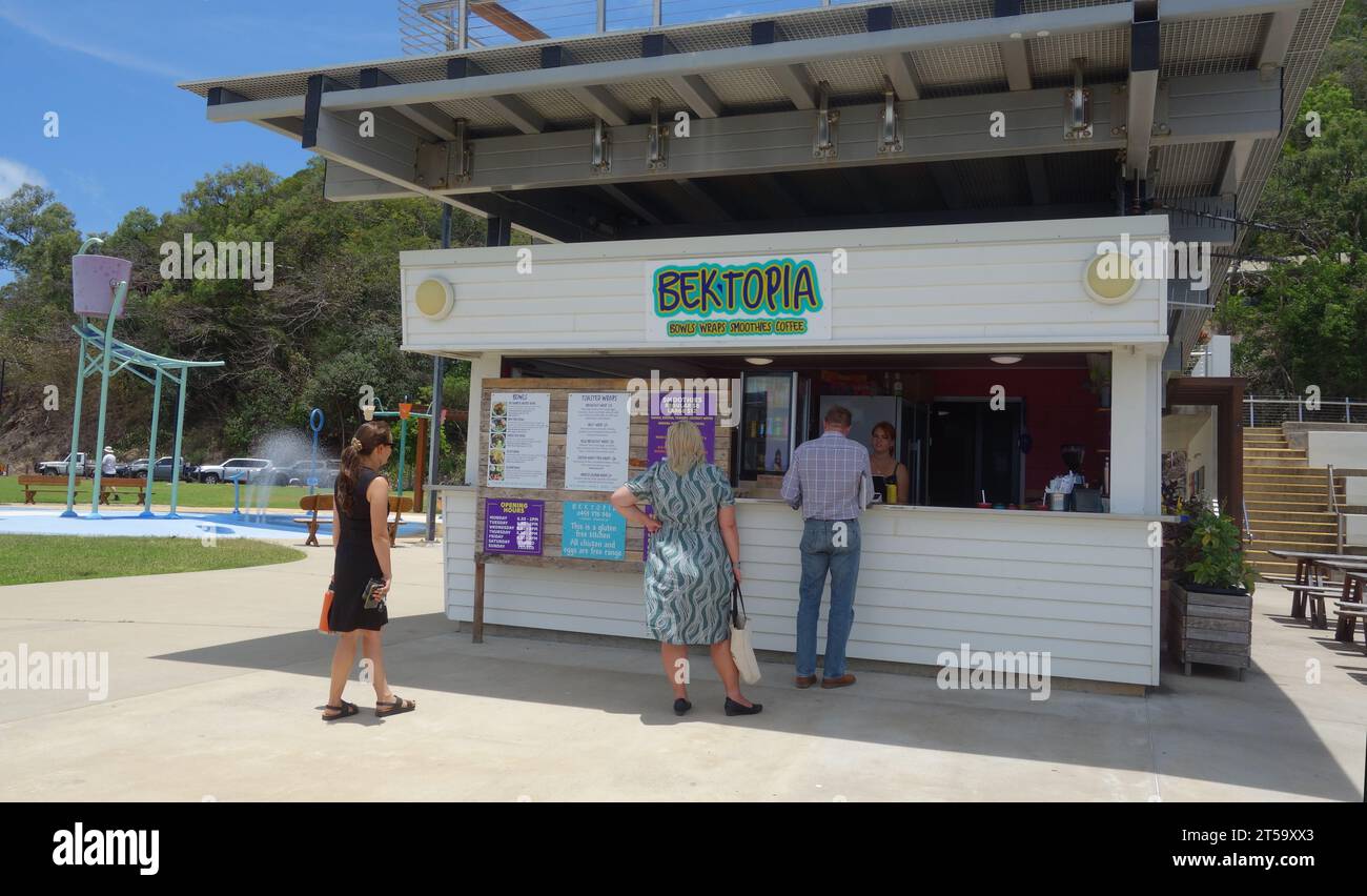 People waiting at Bek-Topia cafe on the Esplanade, Cooktown, southern ...