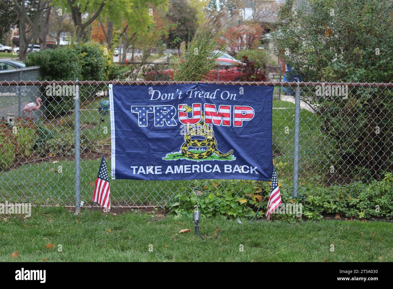 Don't Tread on Trump Take America Back with a rattlesnake flag on fence in Des Plaines, Illinois Stock Photo