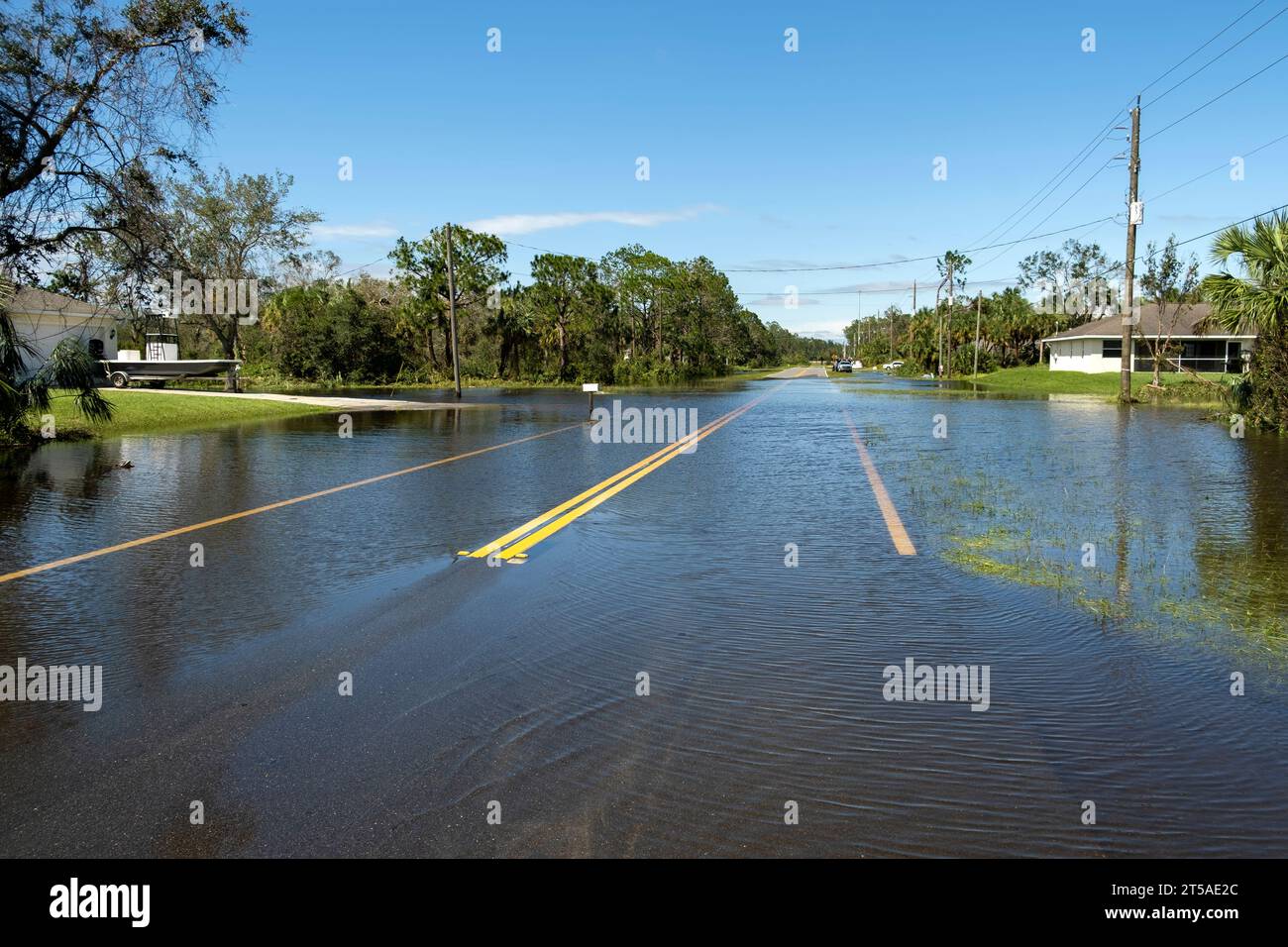Flooded empty street after hurricane rainfall in Florida residential ...