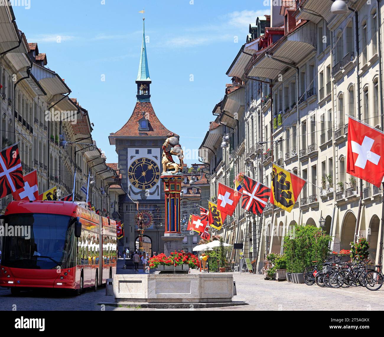 Street view on Kramgasse with Zytglogge Clock Tower in the old town of Bern city. It is a popular shopping street and medieval city centre of Bern Stock Photo