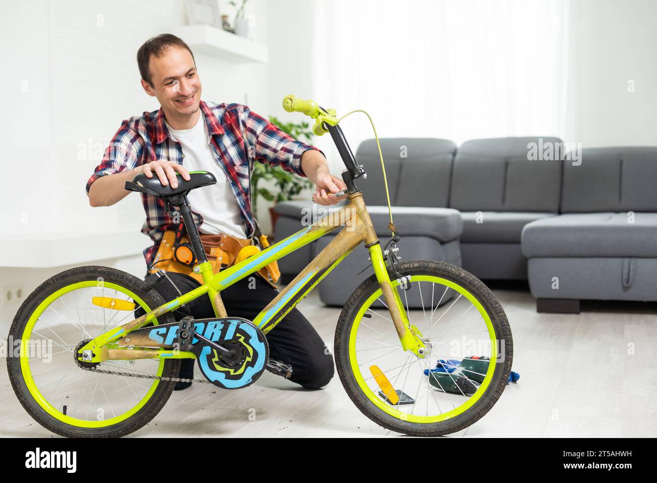 bicycle mechanic adjusting front derailleur mechanism on mountain bike