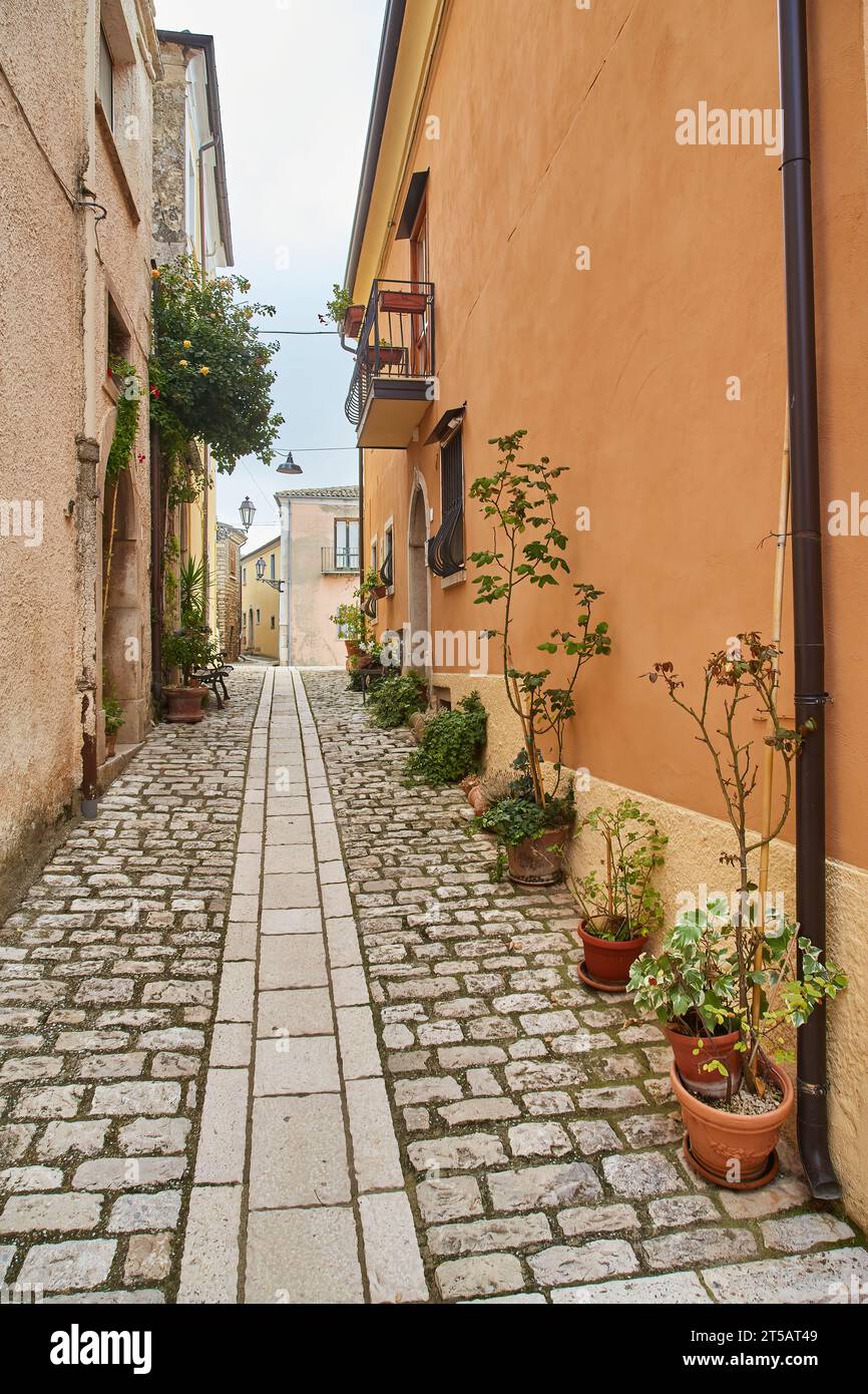 A street among the characteristic houses of Buonalbergo, a village in the mountains in the province of Benevento Stock Photo