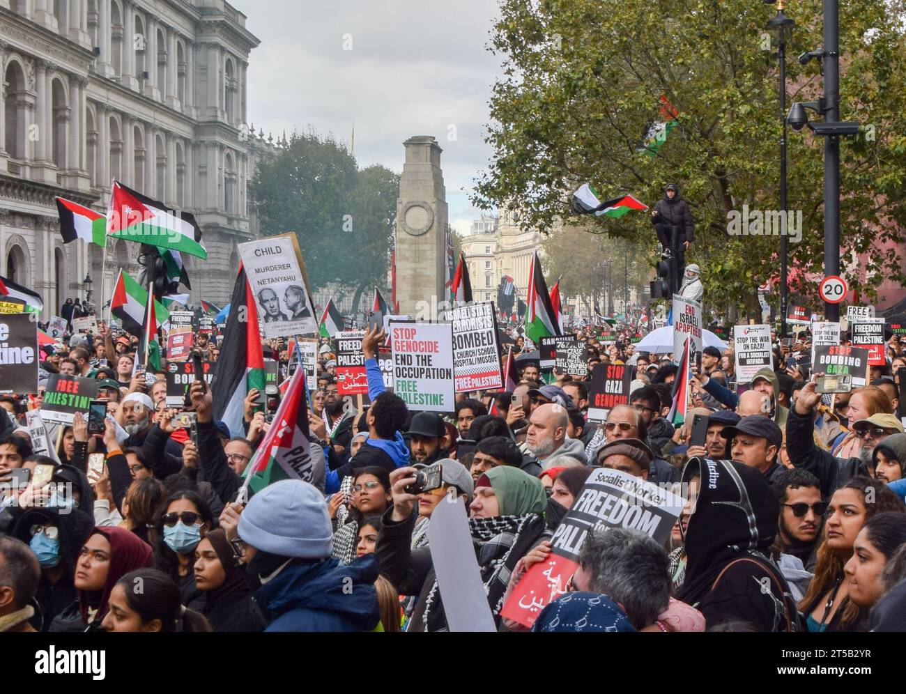 London, UK. 21st October 2023. Protesters gather around The Cenotaph in ...