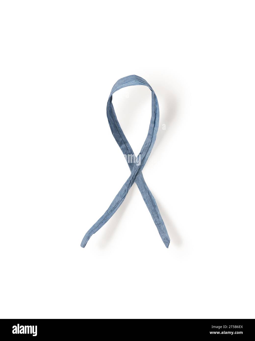 Dark blue paper ribbon symbol of colon cancer isolated on white background, top view Stock Photo