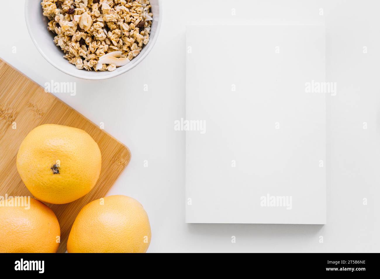 Book cover mockup with oranges cereals Stock Photo Alamy