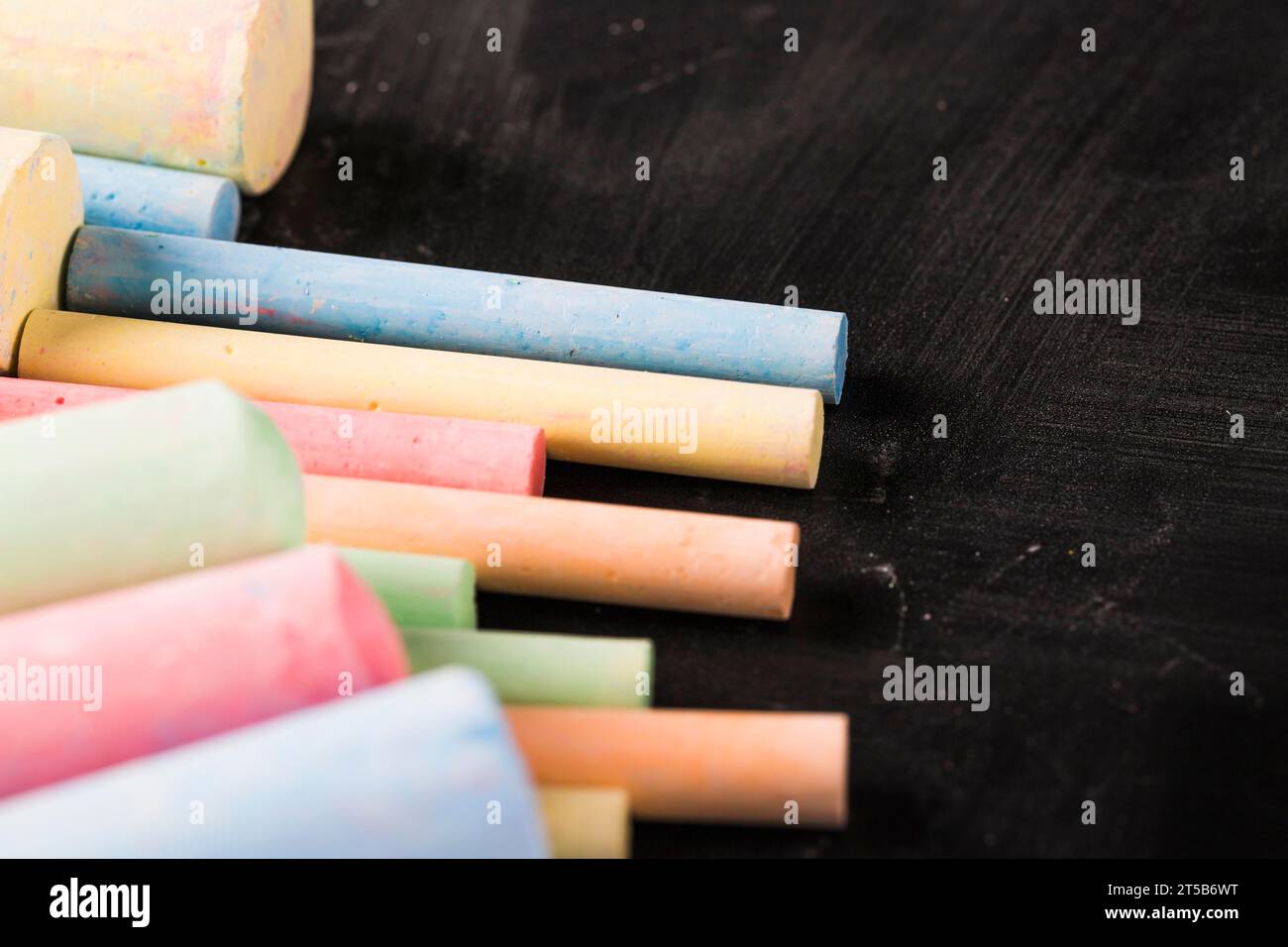 Chalky crayons blackboard Stock Photo Alamy