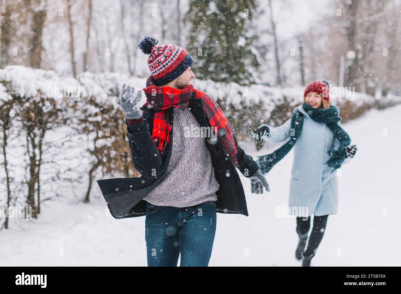 Couple playing snowballs hi-res stock photography and images - Alamy