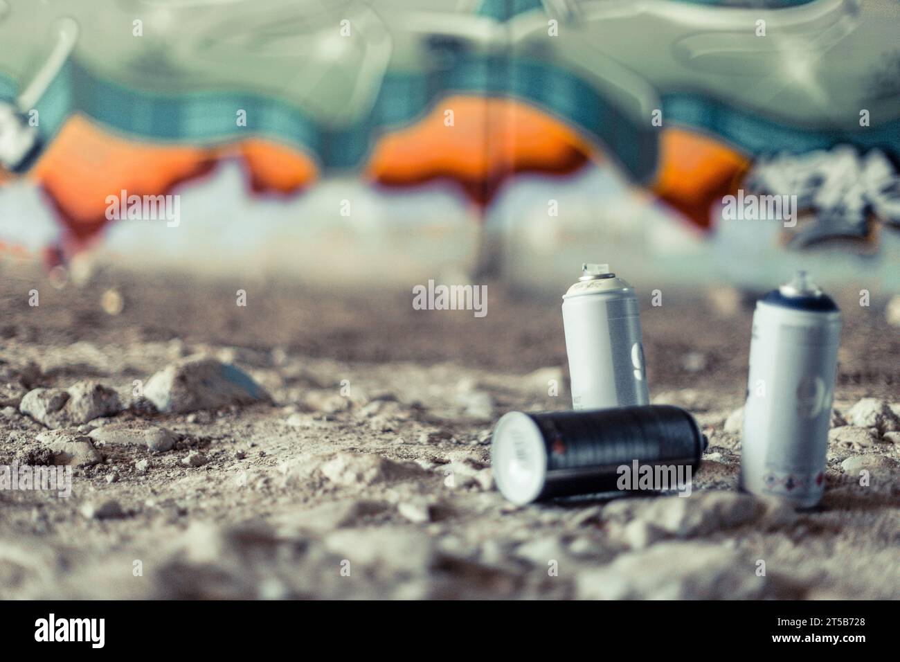 Close up spray cans front graffiti wall Stock Photo - Alamy