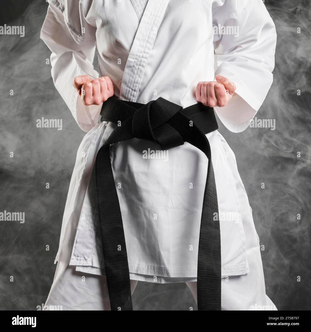 Fighter kimono with black belt Stock Photo