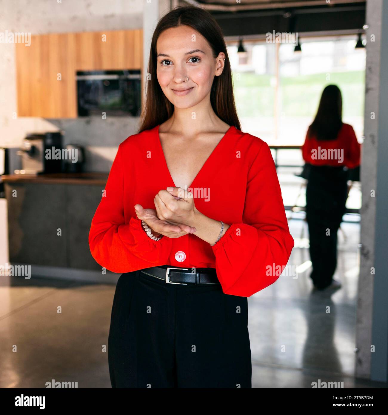 Front view smiley businesswoman using sign language Stock Photo - Alamy