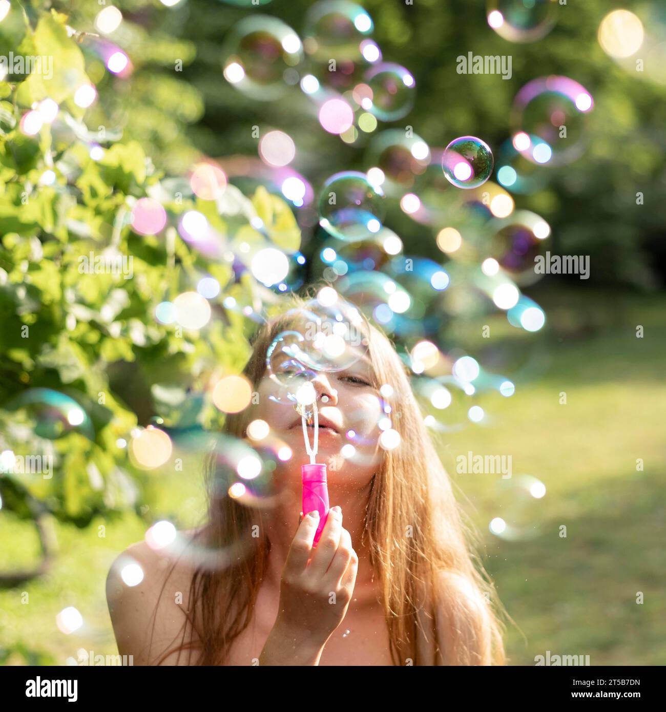 Front view girls making bubbles Stock Photo