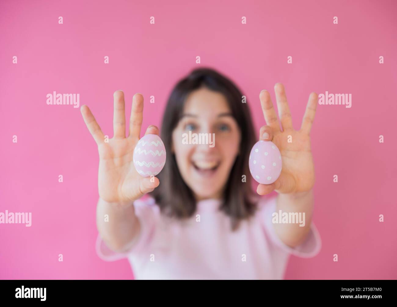 Happy woman holding easter eggs Stock Photo
