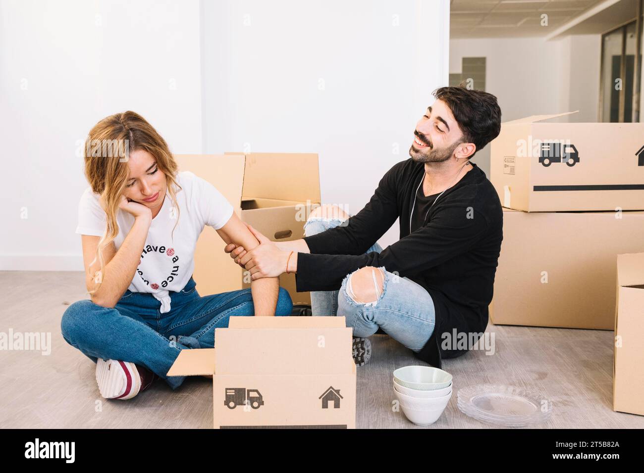 Moving concept with bored couple Stock Photo