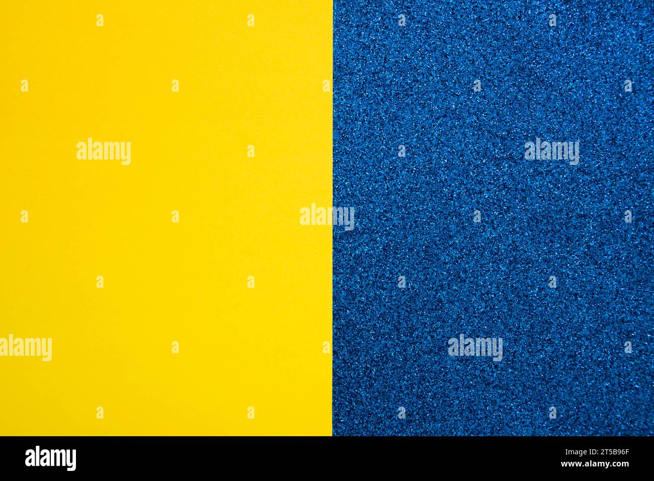 Yellow cardboard paper blue carpet Stock Photo Alamy