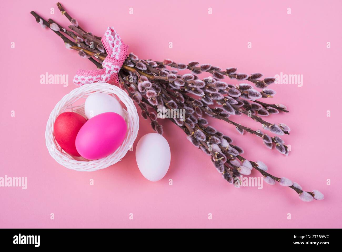Colorful easter eggs with willow branches Stock Photo