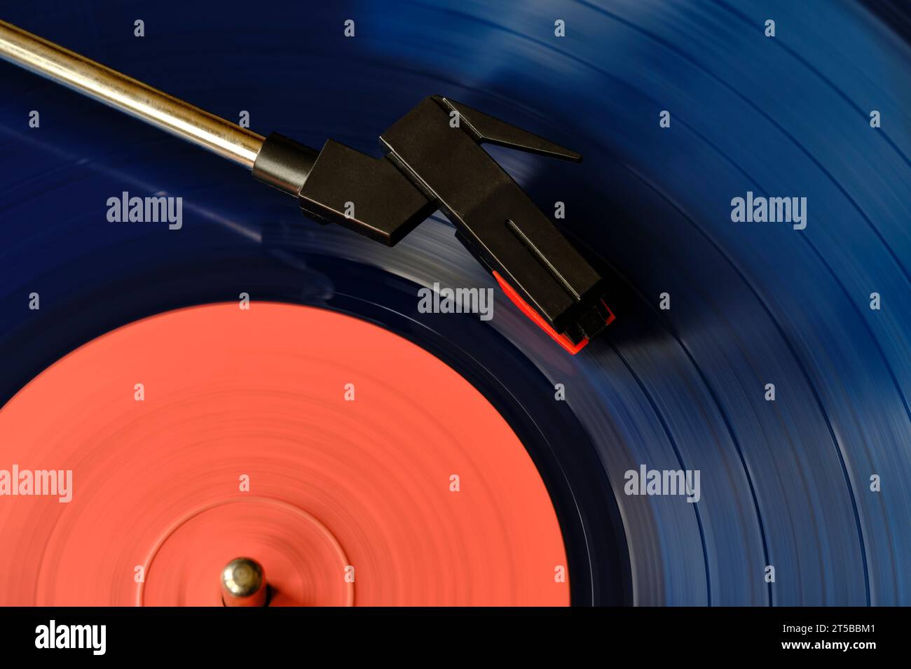 Blue vinyl record and needle for playing music from vinyl top view Stock Photo
