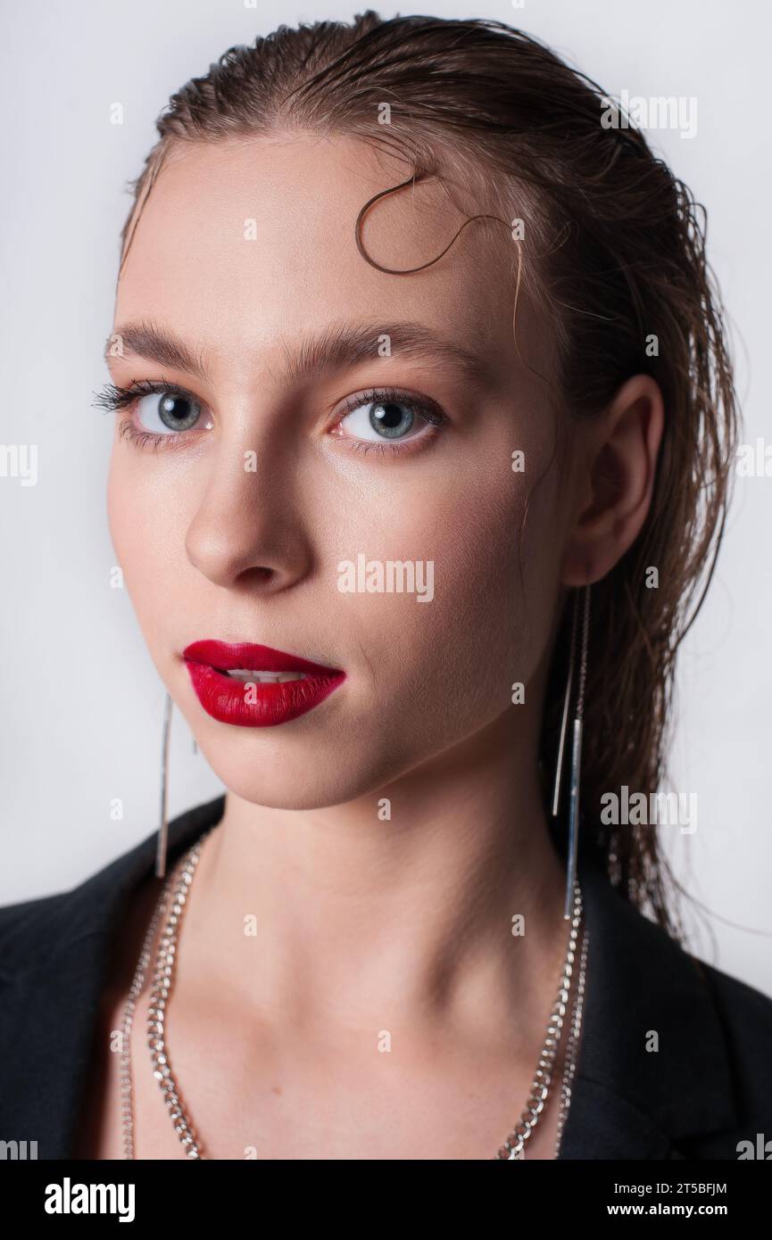 blonde lady looking at camera with red lips Stock Photo
