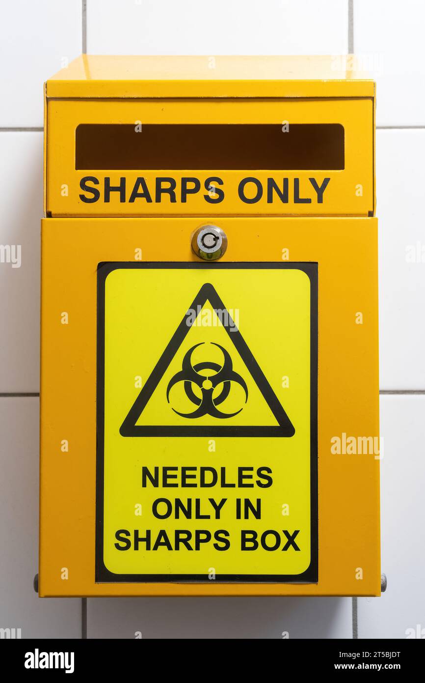 Sharps bin for disposing safely of needles Stock Photo