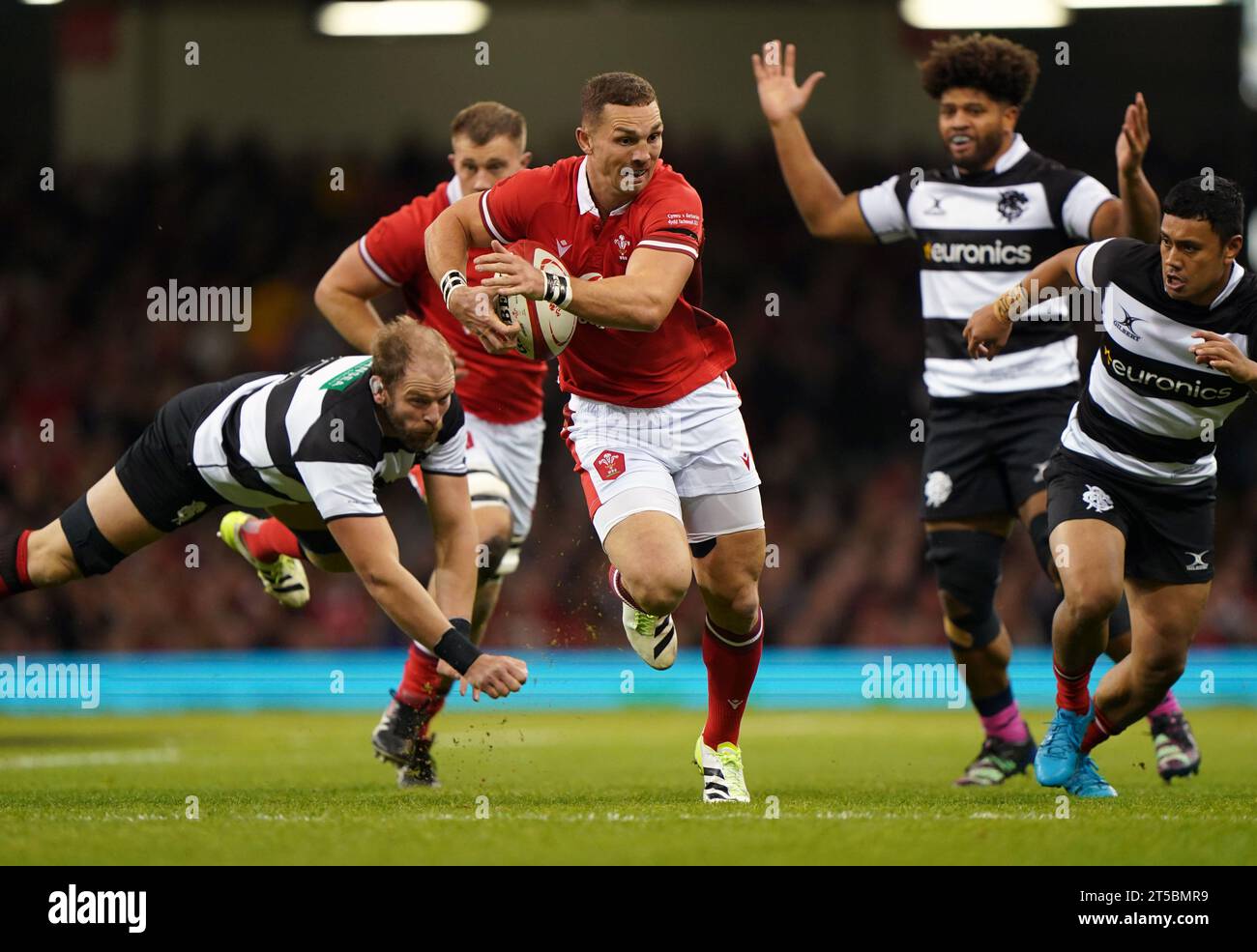 Wales' George North evades a tackle from Barbarians' Alun Wyn Jones during the Autumn International match at the Principality Stadium, Cardiff. Picture date: Saturday November 4, 2023. Stock Photo