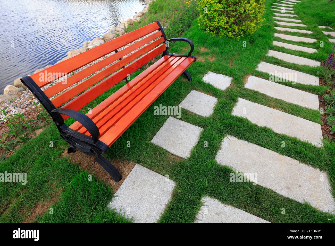 Wooden chair in a park Stock Photo - Alamy