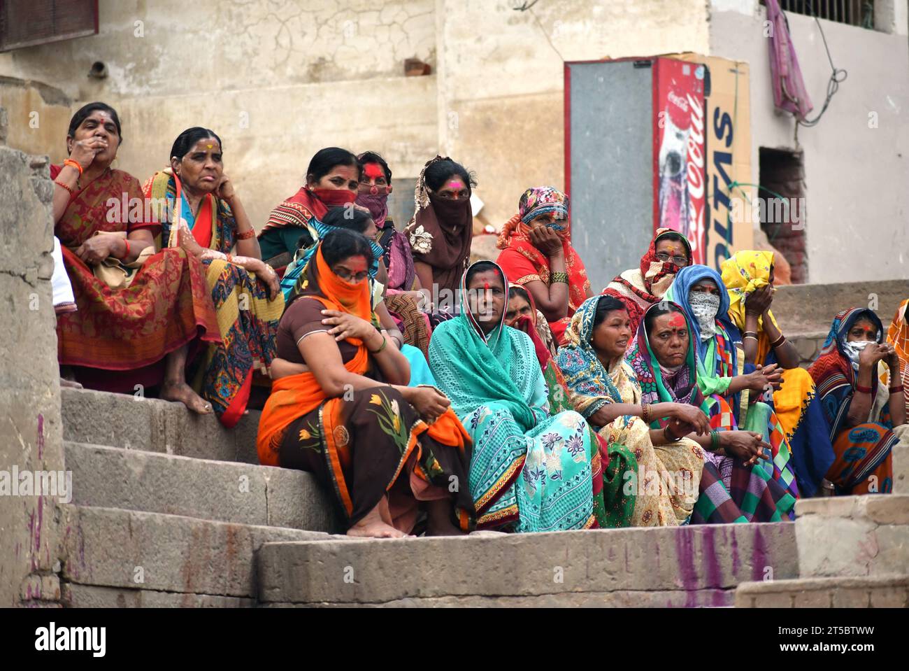 VARANASI, INDIA November 13, 2022 View of a unknowns Indian people in fromt of shop in the