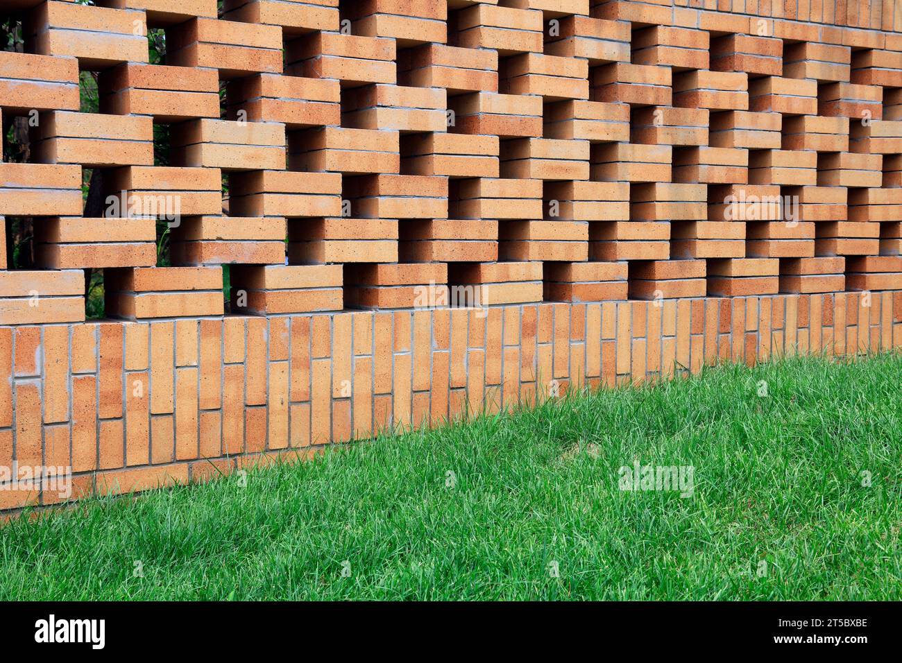 lattice wall and grass in the park Stock Photo