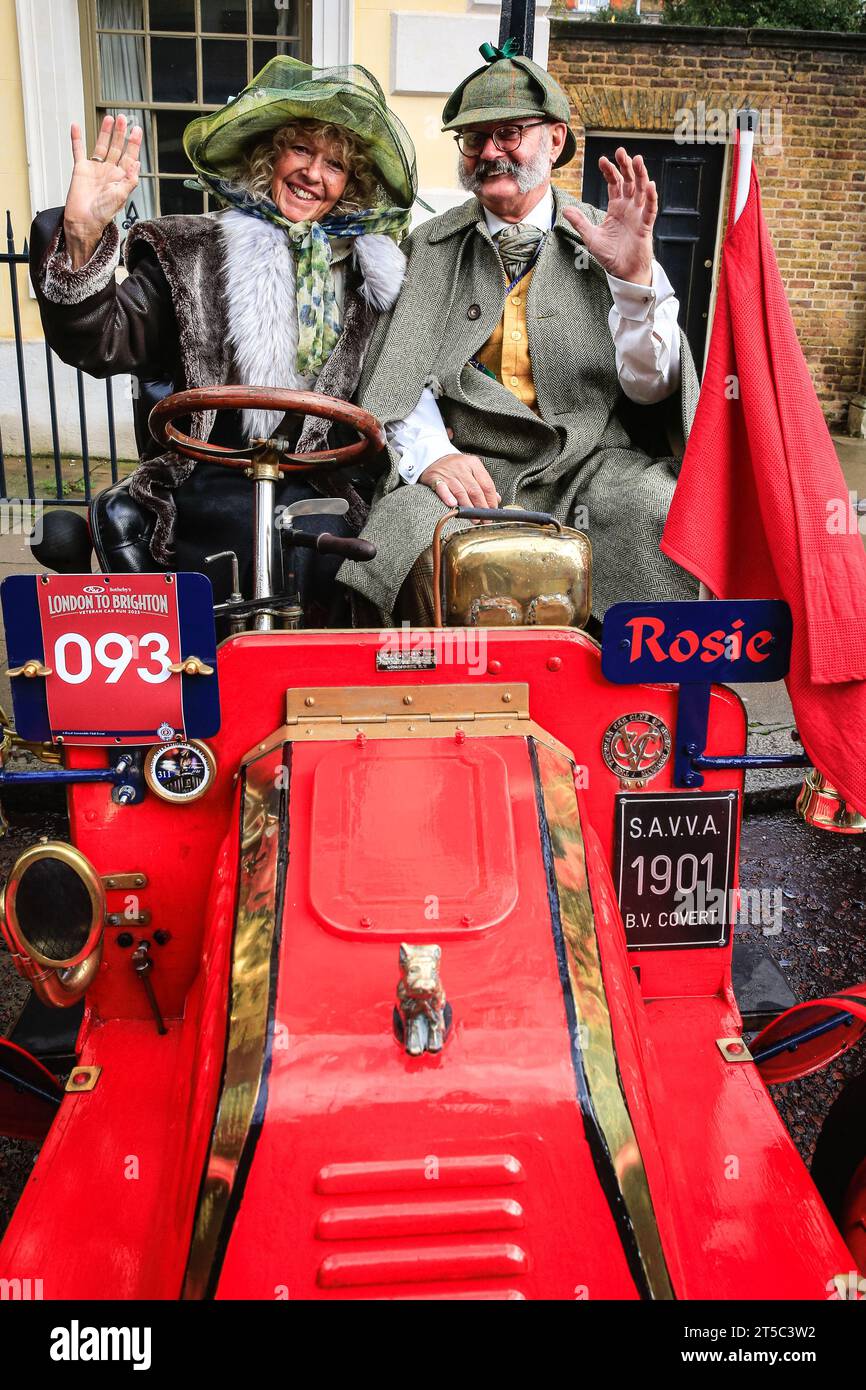London, UK. 04th Nov, 2023. The owners of a 1901 Covert called 'Rosie' in their car. Over one hundred pre-1905 veteran cars are on display in the showcase event next to James's Palace, previewing the RM Sotheby's London to Brighton Run on Sunday. Credit: Imageplotter/Alamy Live News Stock Photo