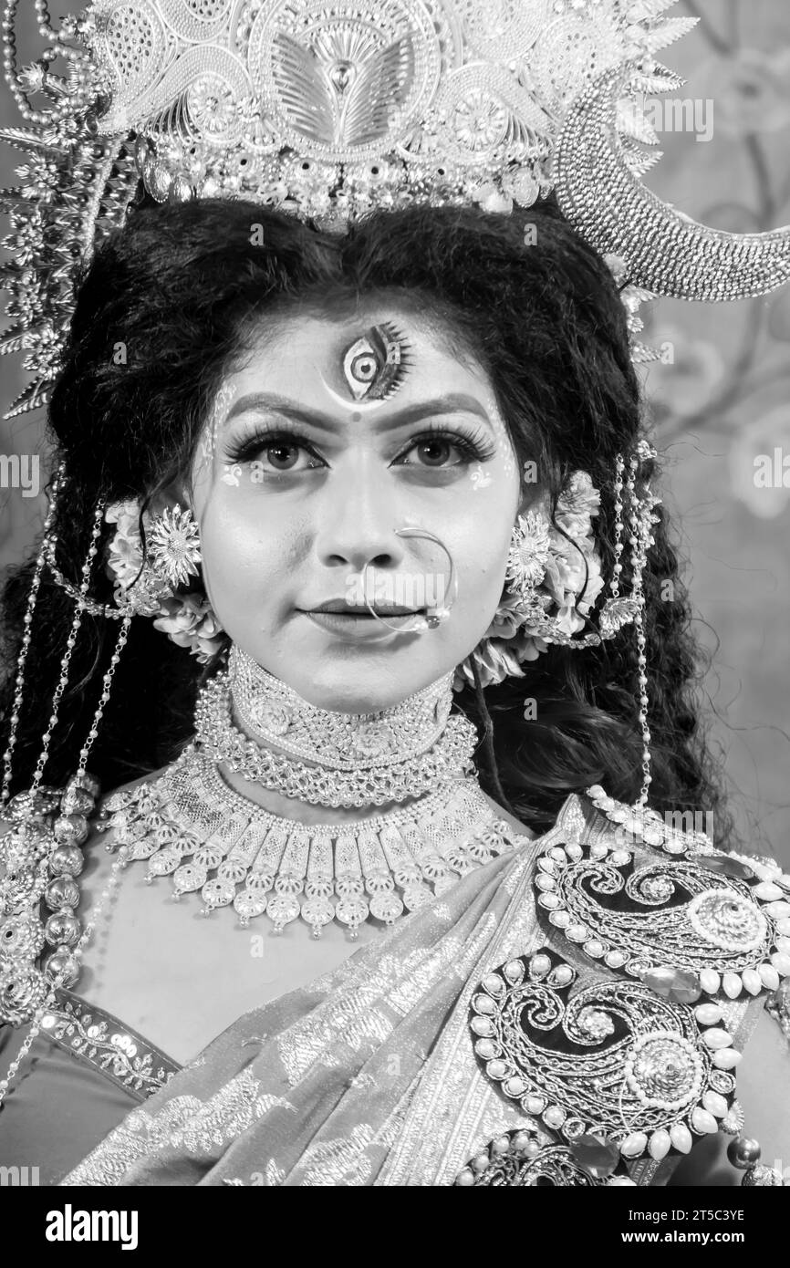 Portrait of beautiful Indian girl of Durga Idol Agomoni Concept Indoor