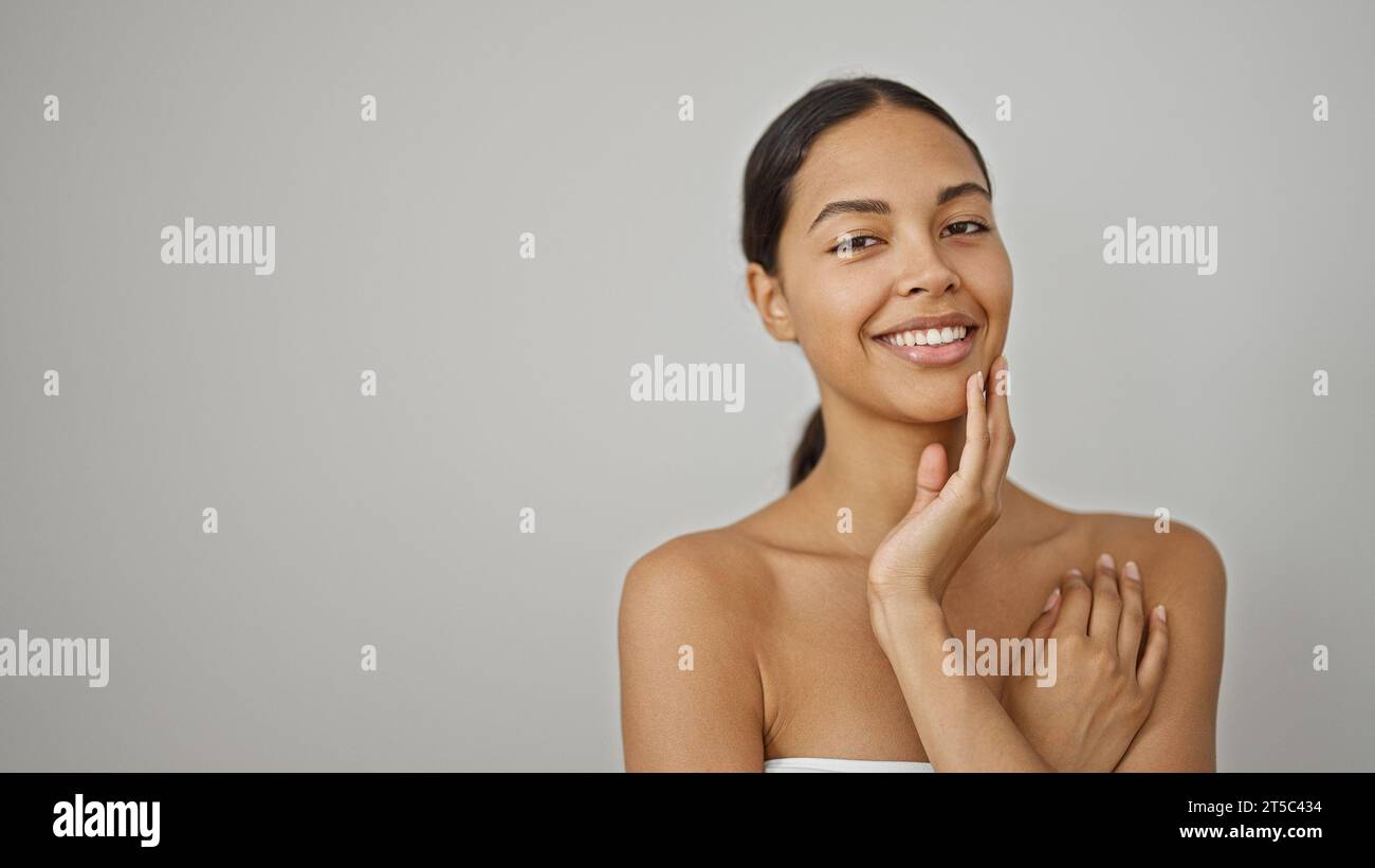 African american woman smiling confident touching face over isolated ...