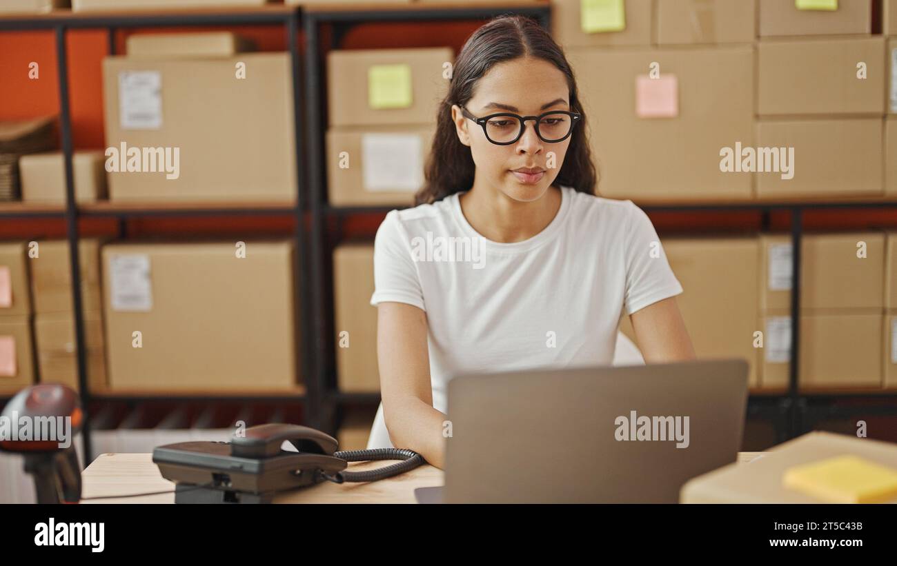 Serious african worker packing hi-res stock photography and images - Alamy