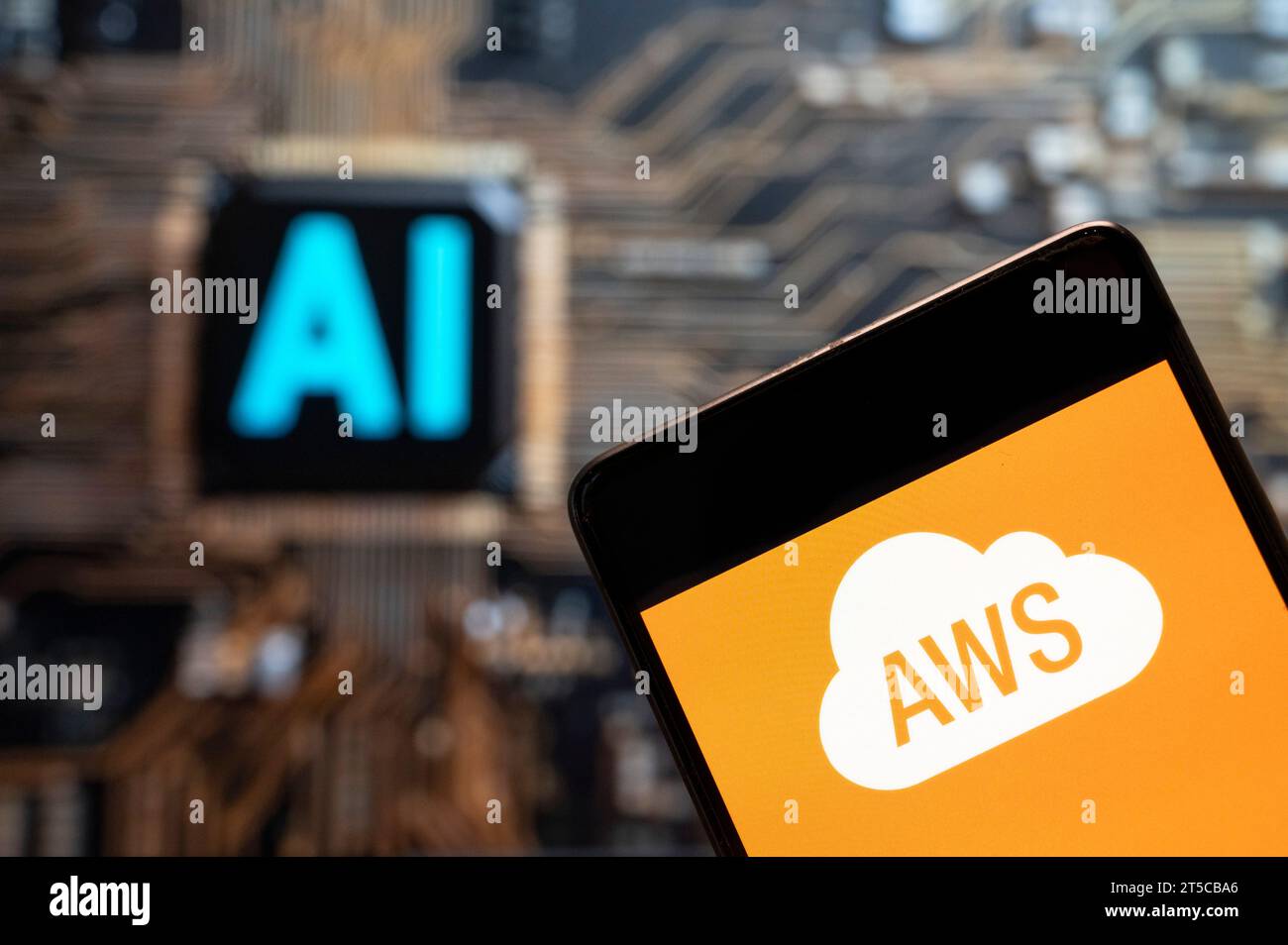 In this photo illustration, the American on-demand cloud computing platform owned by Amazon, Amazon Web Services (AWS) logo seen displayed on a smartphone with Artificial intelligence (AI) chip and symbol in the background. Stock Photo