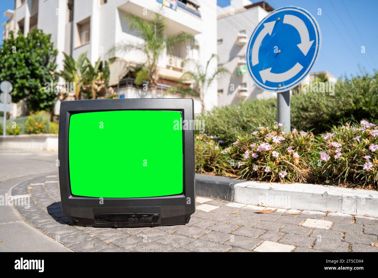 Old TV set with a green screen on the city street Stock Photo Alamy