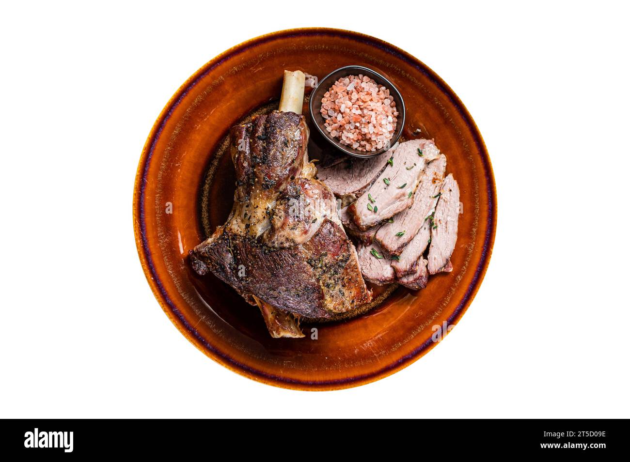 BBQ Roast Lamb mutton leg sliced on a rustic plate. Isolated on white