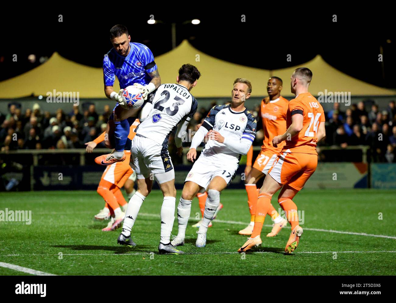 Blackpool goalkeeper Richard O'Donnell saves the ball from Bromley's Besart Topalloj during the Emirates FA Cup first round match at the RELOC8 EM Community Stadium, Bromley. Picture date: Saturday November 4, 2023. Stock Photo