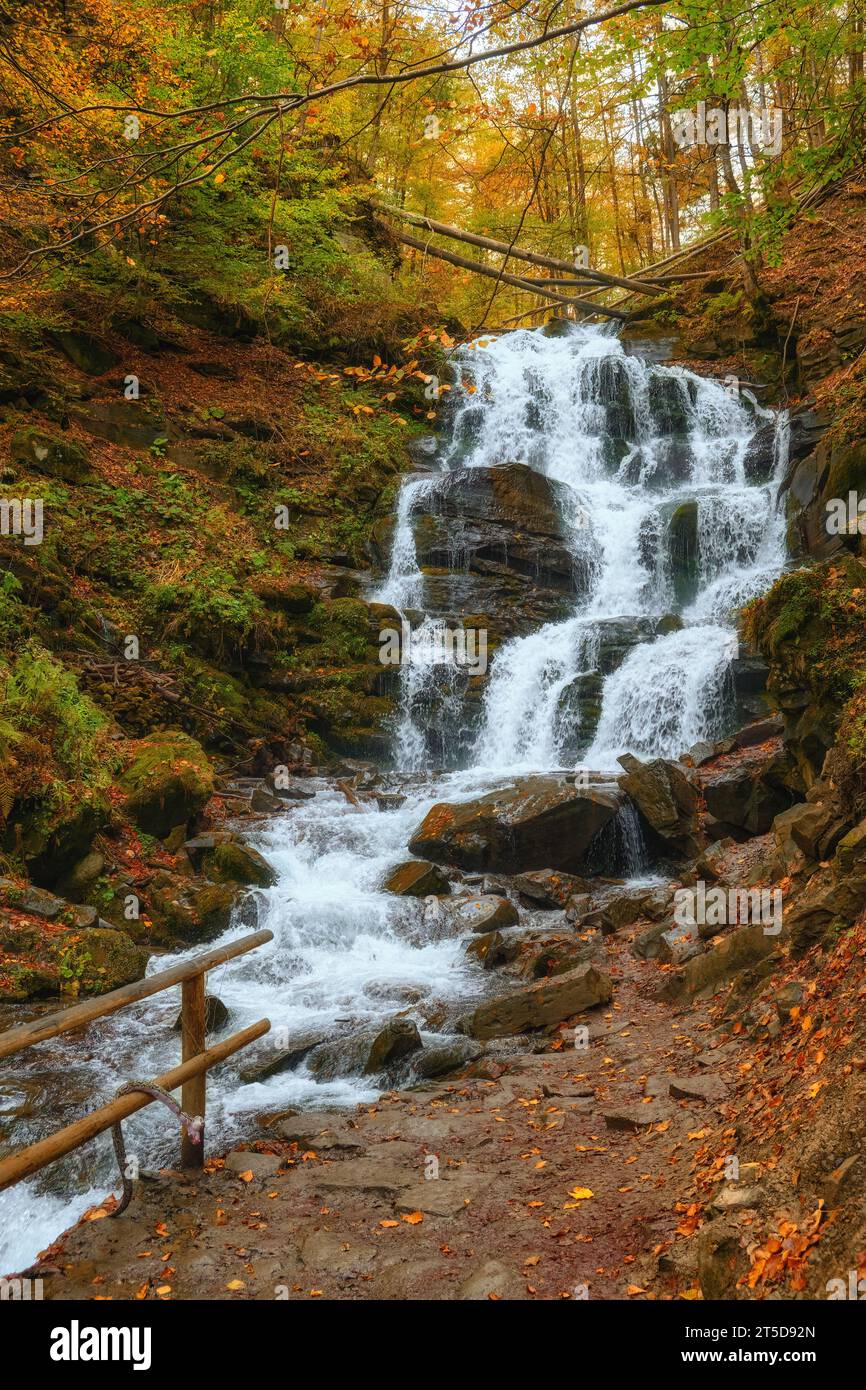 Beautiful Waterfall Shipot in the autumn forest of the Carpathian Mountains Stock Photo