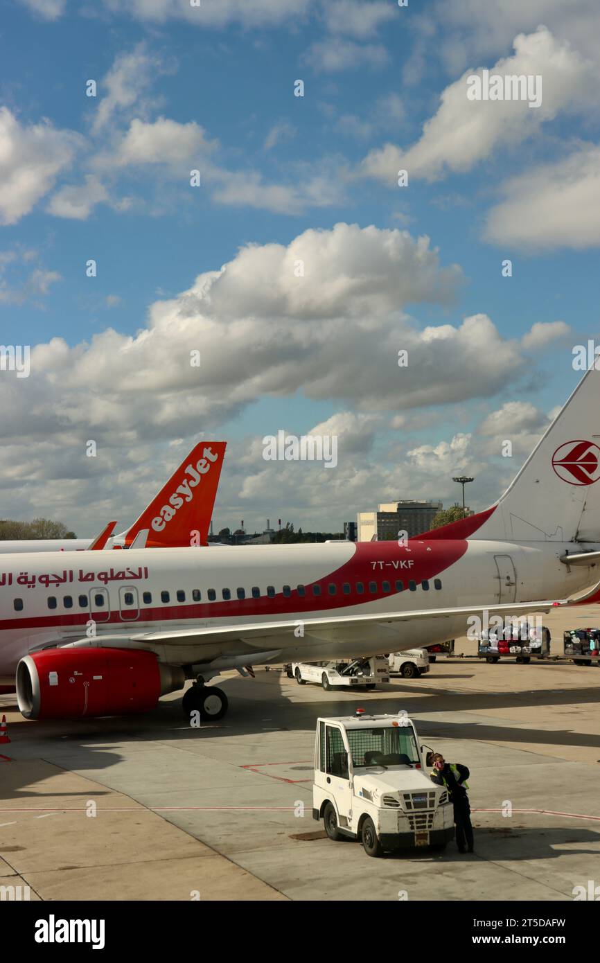 Air Algérie and Easy Jet plane at gate at Charles de Gaulle Airport in Paris, France Stock Photo