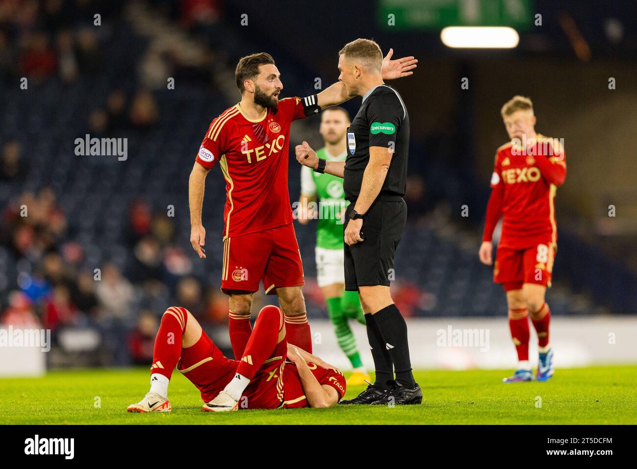 Glasgow, Scotland. 04 November 2023. Graeme Shinnie (4 Aberdeen) unhappy with calls made by